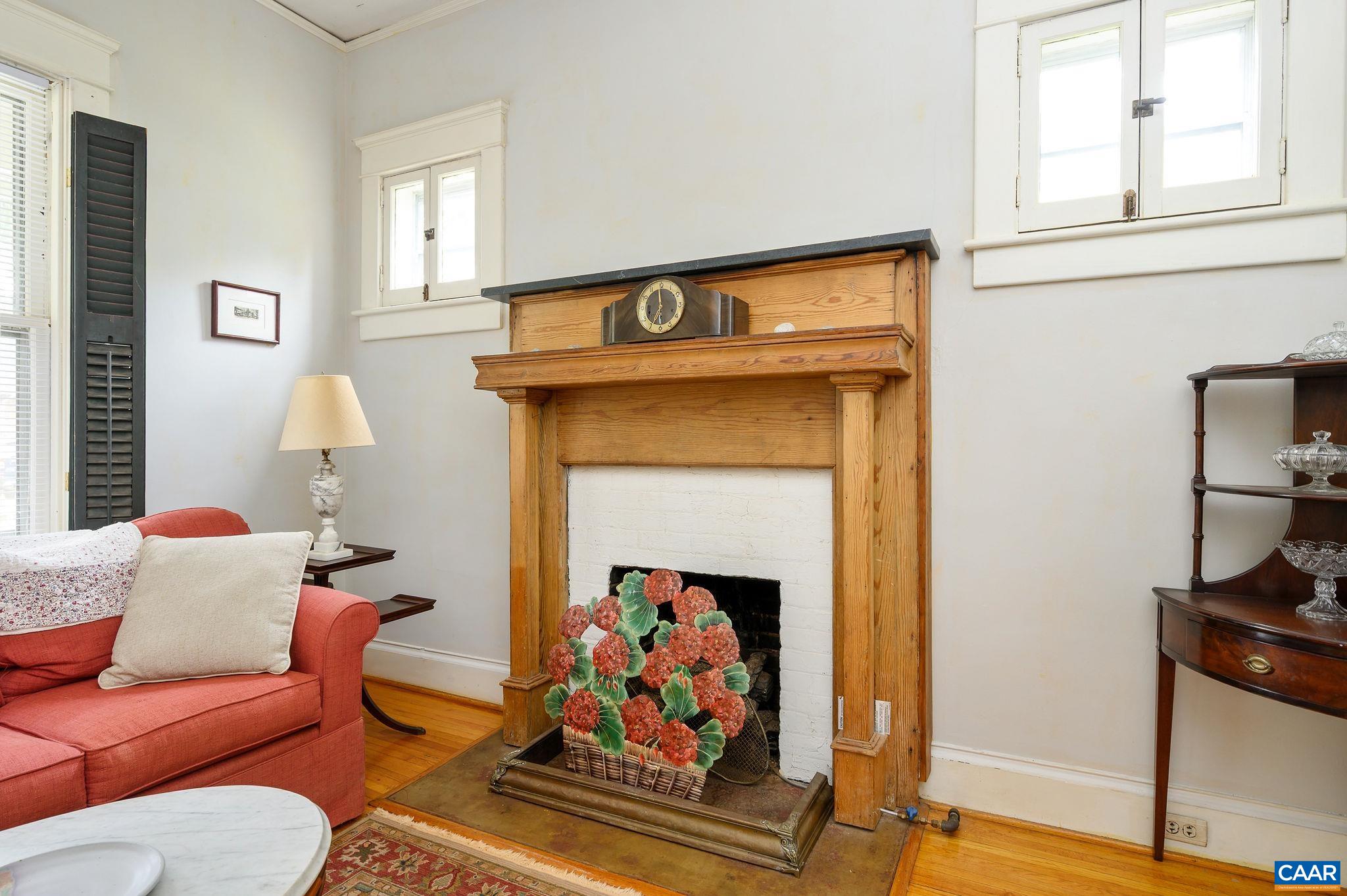 211 Robertson Avenue Charlottesville, VA 22903 - Photo 5 of 28 a living room with furniture and a fireplace