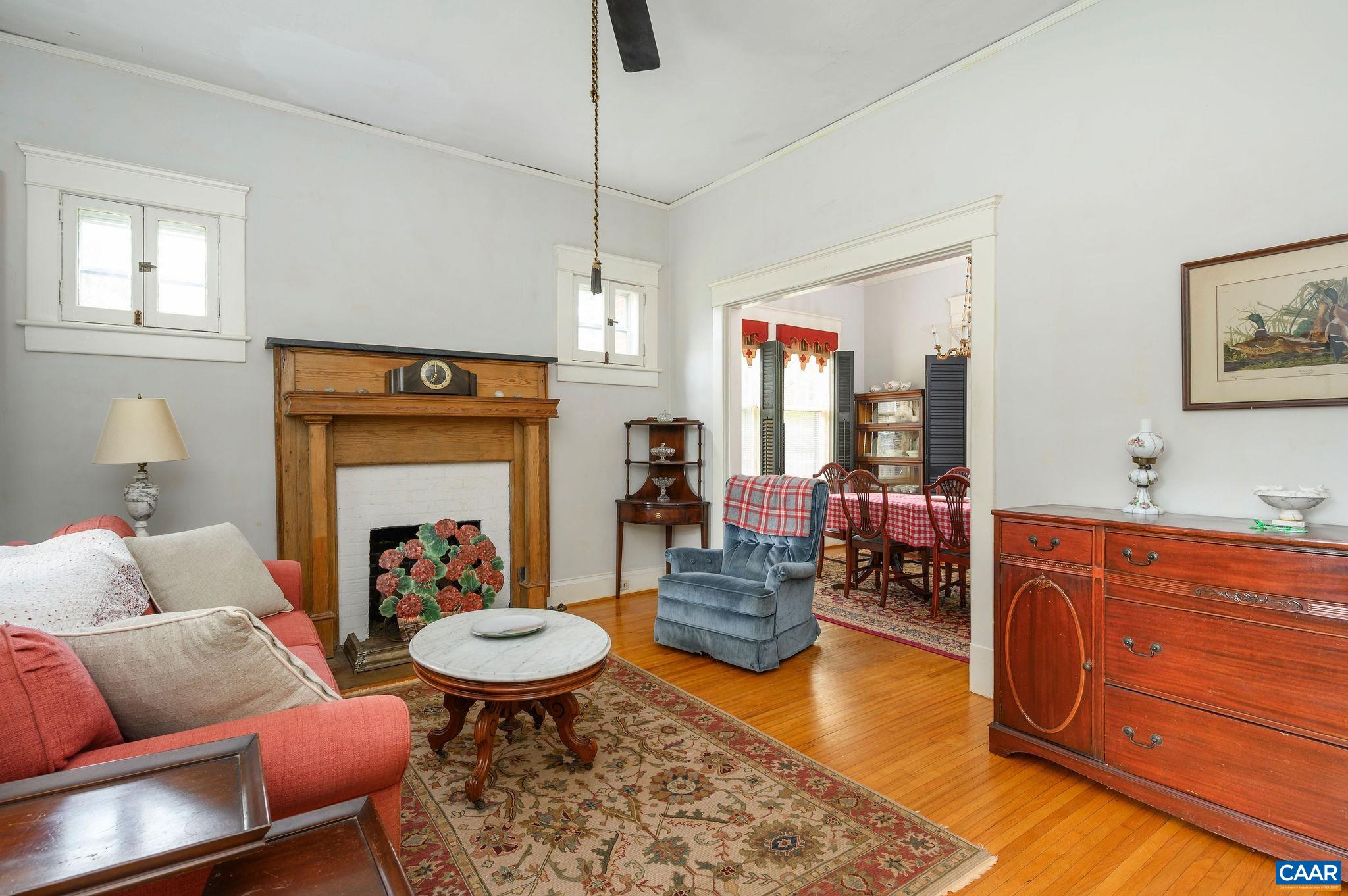 211 Robertson Avenue Charlottesville, VA 22903 - Photo 7 of 28 a living room with furniture and a fireplace