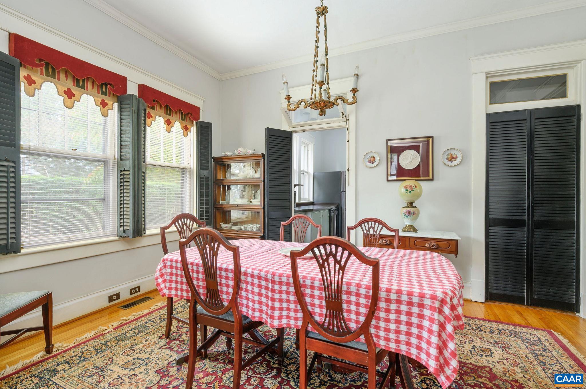 211 Robertson Avenue Charlottesville, VA 22903 - Photo 8 of 28 a dining room with furniture a chandelier and window