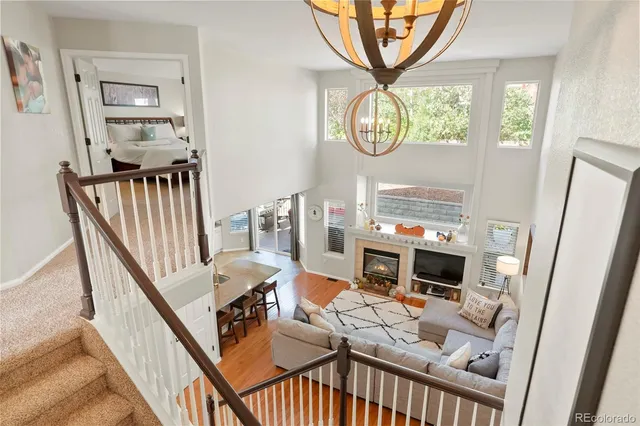 a living room with furniture a fireplace and a window