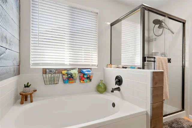 a bathroom with a bathtub and a window