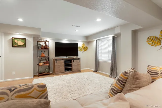 a bedroom with a bed and a television