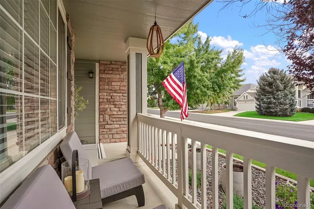 a view of a balcony with chairs