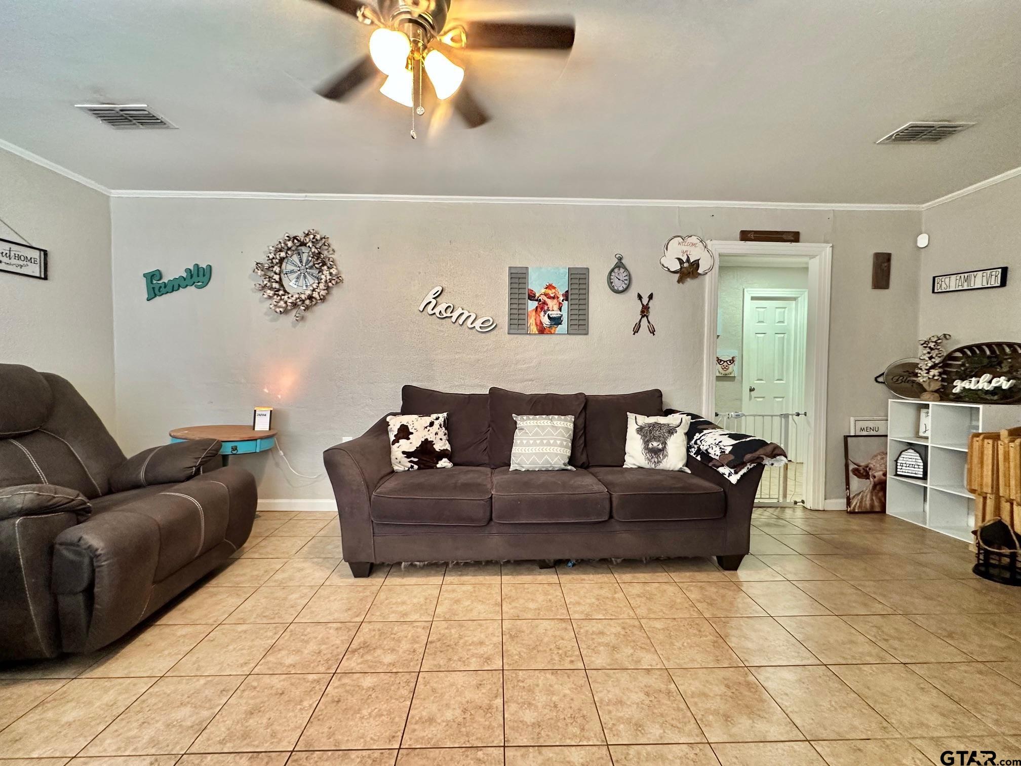2601 East George Richey Road Longview, TX 75604 - Photo 7 of 26 a living room with furniture and a couch