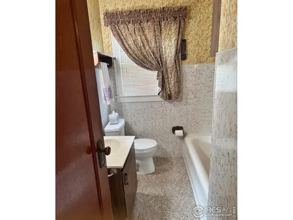 a bathroom with a sink and toilet
