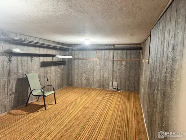 a view of a room with wooden floor and chair