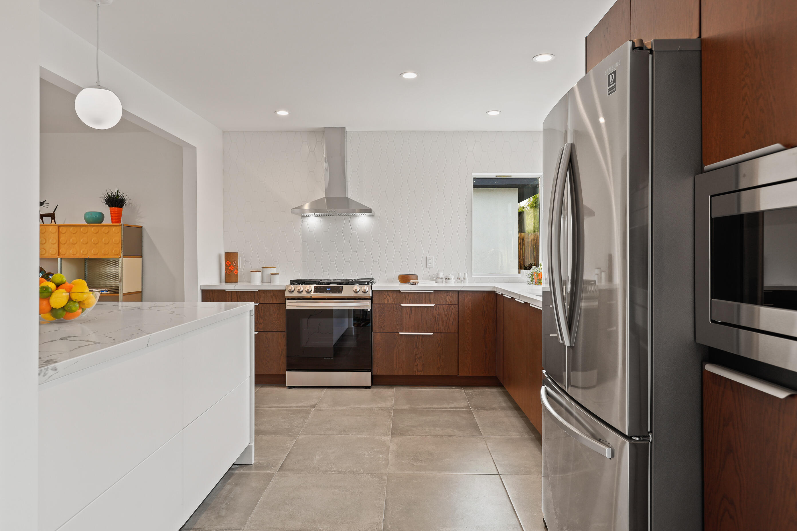 70170 Sun Valley Drive Rancho Mirage, CA 92270 - Photo 12 of 25 a large kitchen with stainless steel appliances granite countertop a refrigerator and a stove