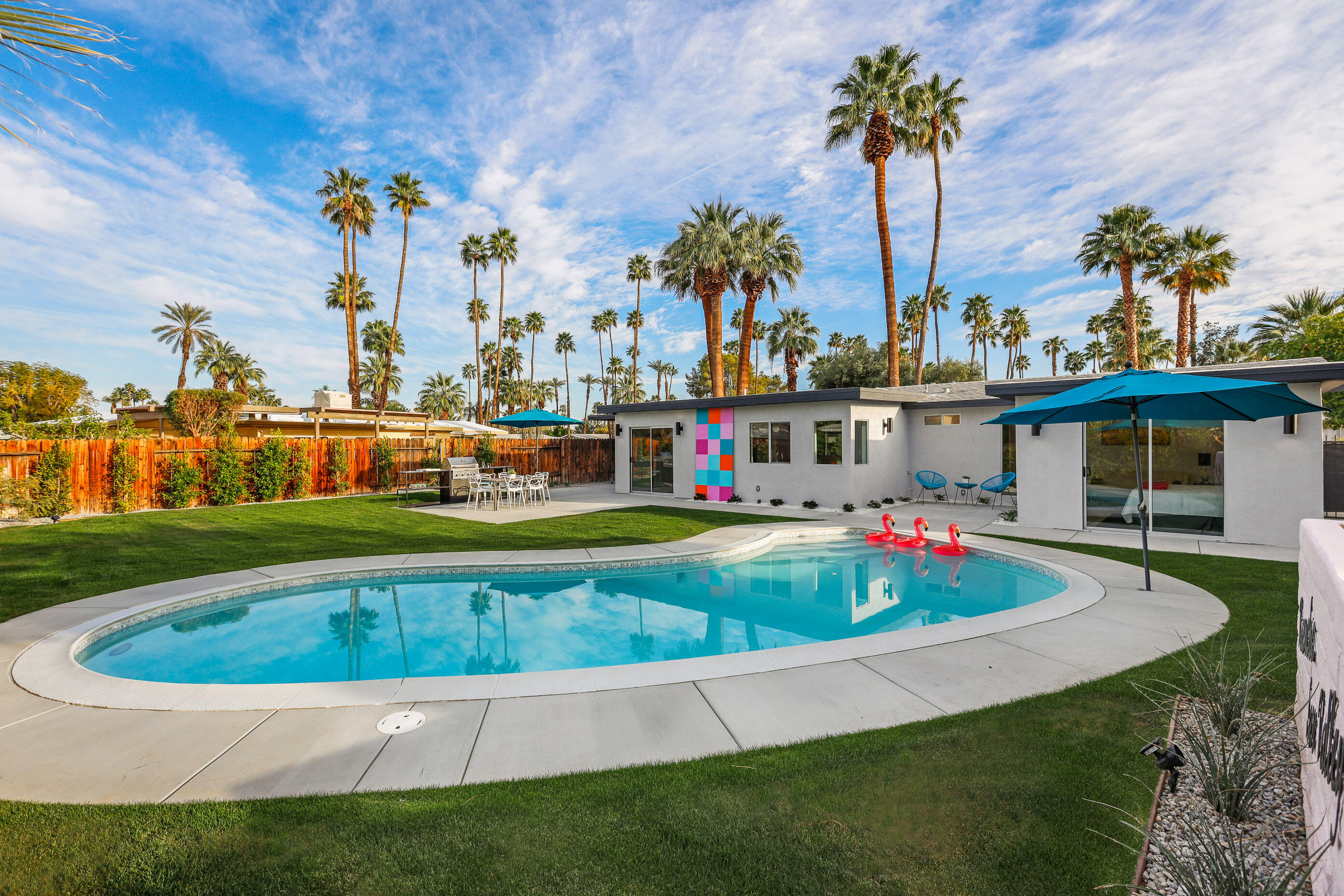70170 Sun Valley Drive Rancho Mirage, CA 92270 - Photo 22 of 25 a view of a swimming pool with a garden