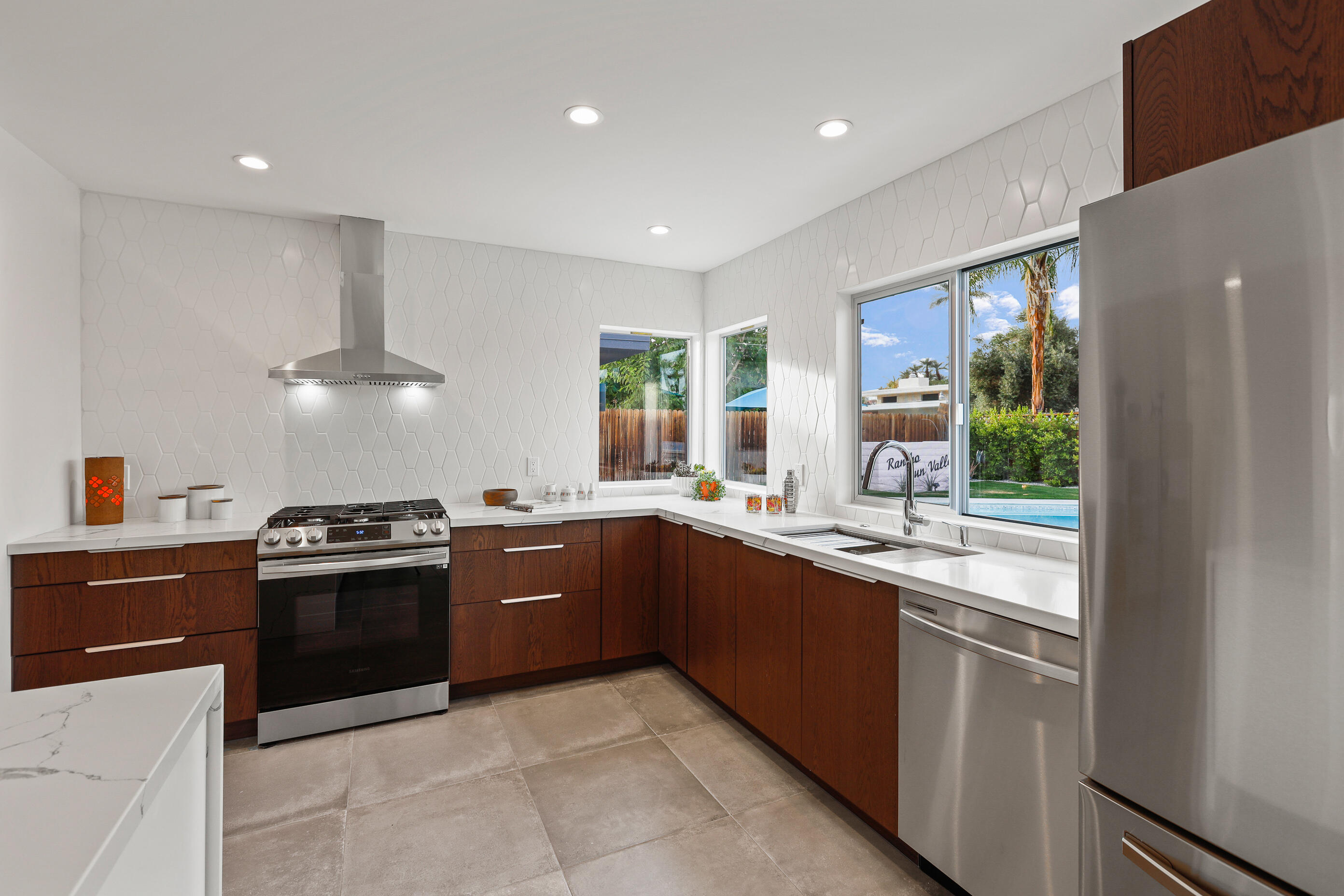 70170 Sun Valley Drive Rancho Mirage, CA 92270 - Photo 9 of 25 a kitchen with granite countertop stainless steel appliances and sink