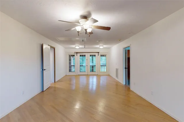 a view of an entryway with wooden floor