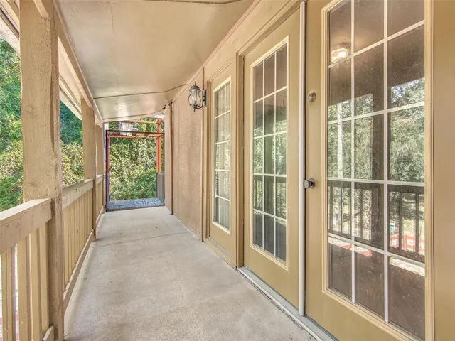 a view of a glass door and deck