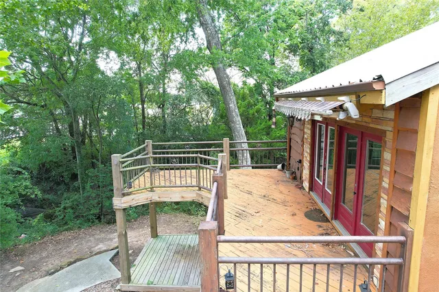 a view of a field with trees in the background