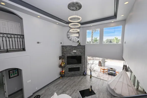 a view of living room with furniture and a fireplace