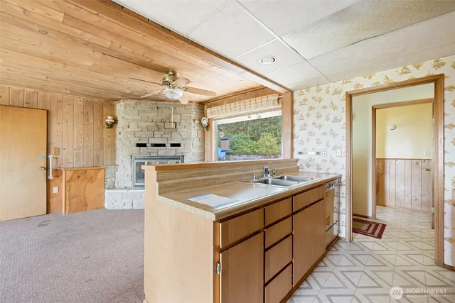 a kitchen with a sink and cabinets
