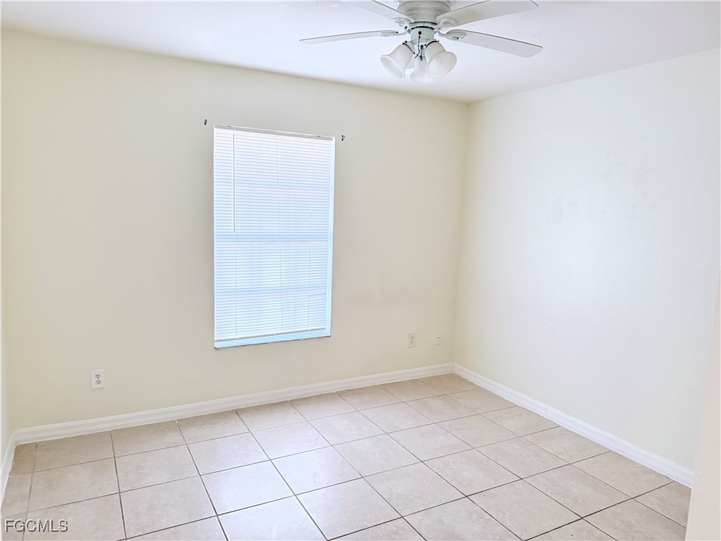 4731 24th Street Southwest Lehigh Acres, FL 33973 - Photo 7 of 8 an empty room with a window