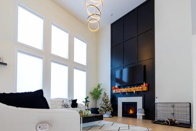 a view of a dining room with furniture and a potted plant