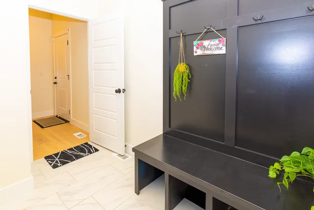 a bed sitting in a bedroom next to a window