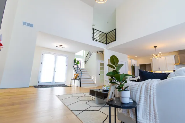 a bedroom with a bed and a ceiling fan