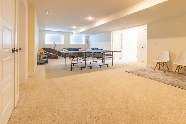 a view of a livingroom with wooden floor and cabinet
