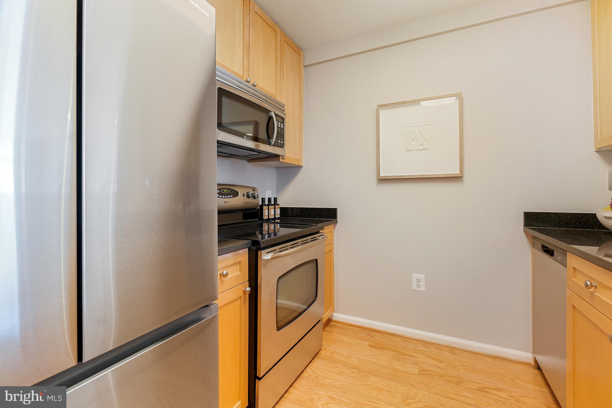 11700 Old Georgetown Road, Unit 214 Rockville, MD 20852 - Photo 11 of 44 a utility room with dryer and washer