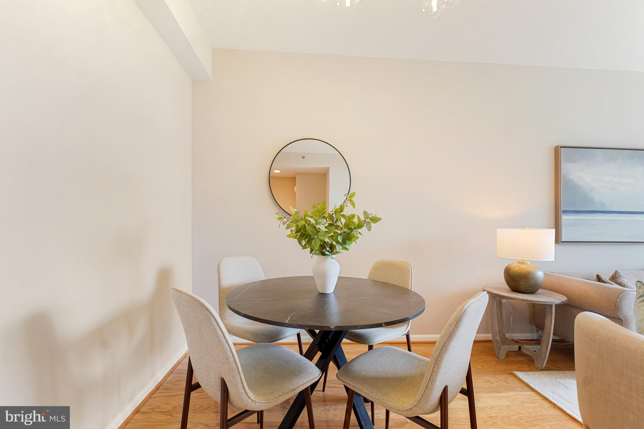 11700 Old Georgetown Road, Unit 214 Rockville, MD 20852 - Photo 15 of 44 a view of a dining room with furniture and wooden floor