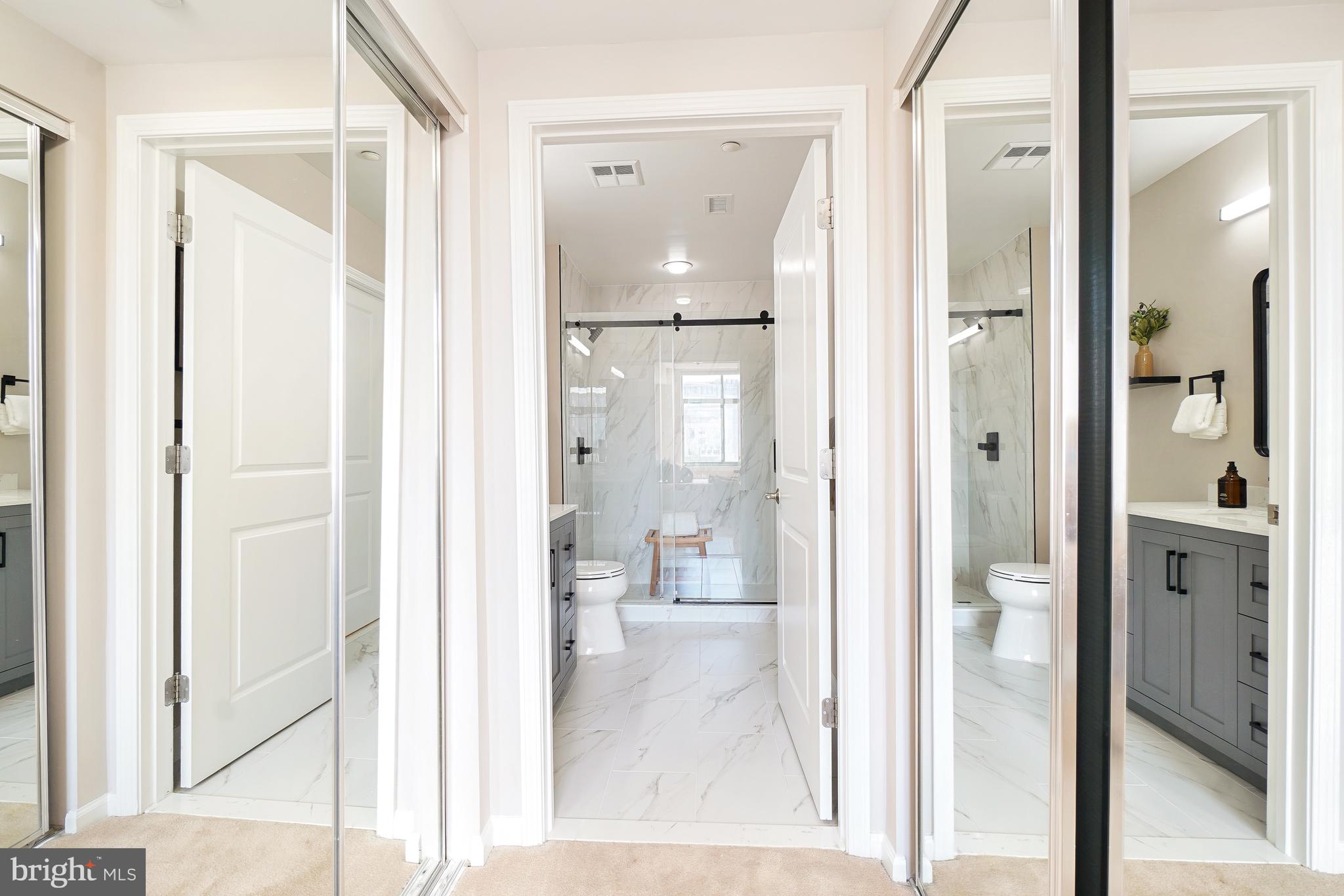 11700 Old Georgetown Road, Unit 214 Rockville, MD 20852 - Photo 30 of 44 a bathroom with a glass shower door