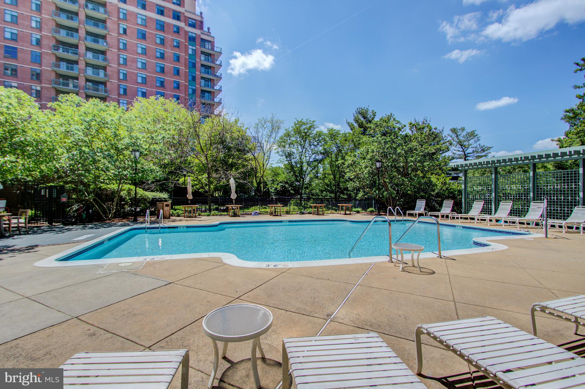11700 Old Georgetown Road, Unit 214 Rockville, MD 20852 - Photo 36 of 44 a view of a swimming pool with a patio