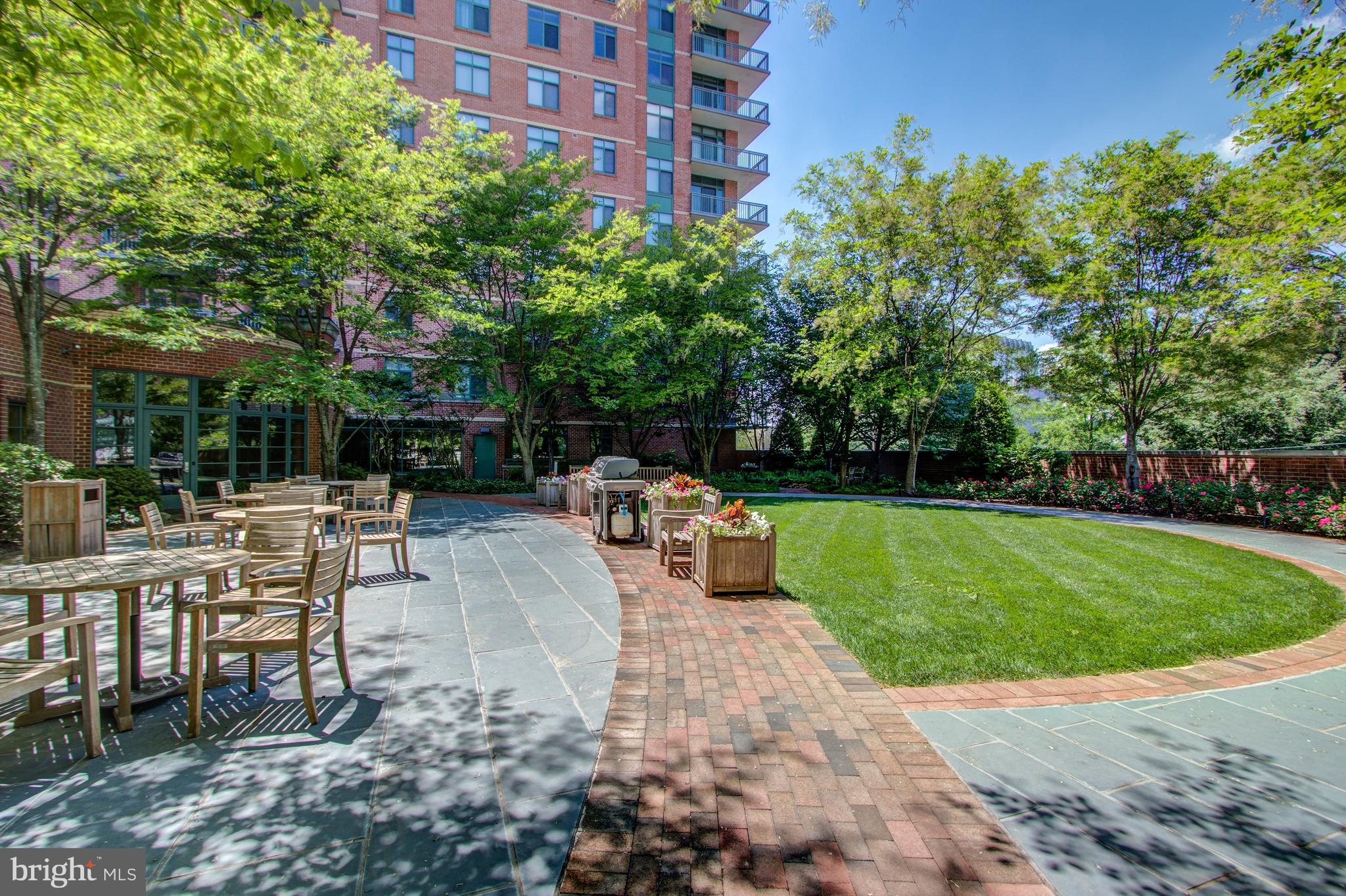 11700 Old Georgetown Road, Unit 214 Rockville, MD 20852 - Photo 37 of 44 a view of backyard with patio and outdoor seating