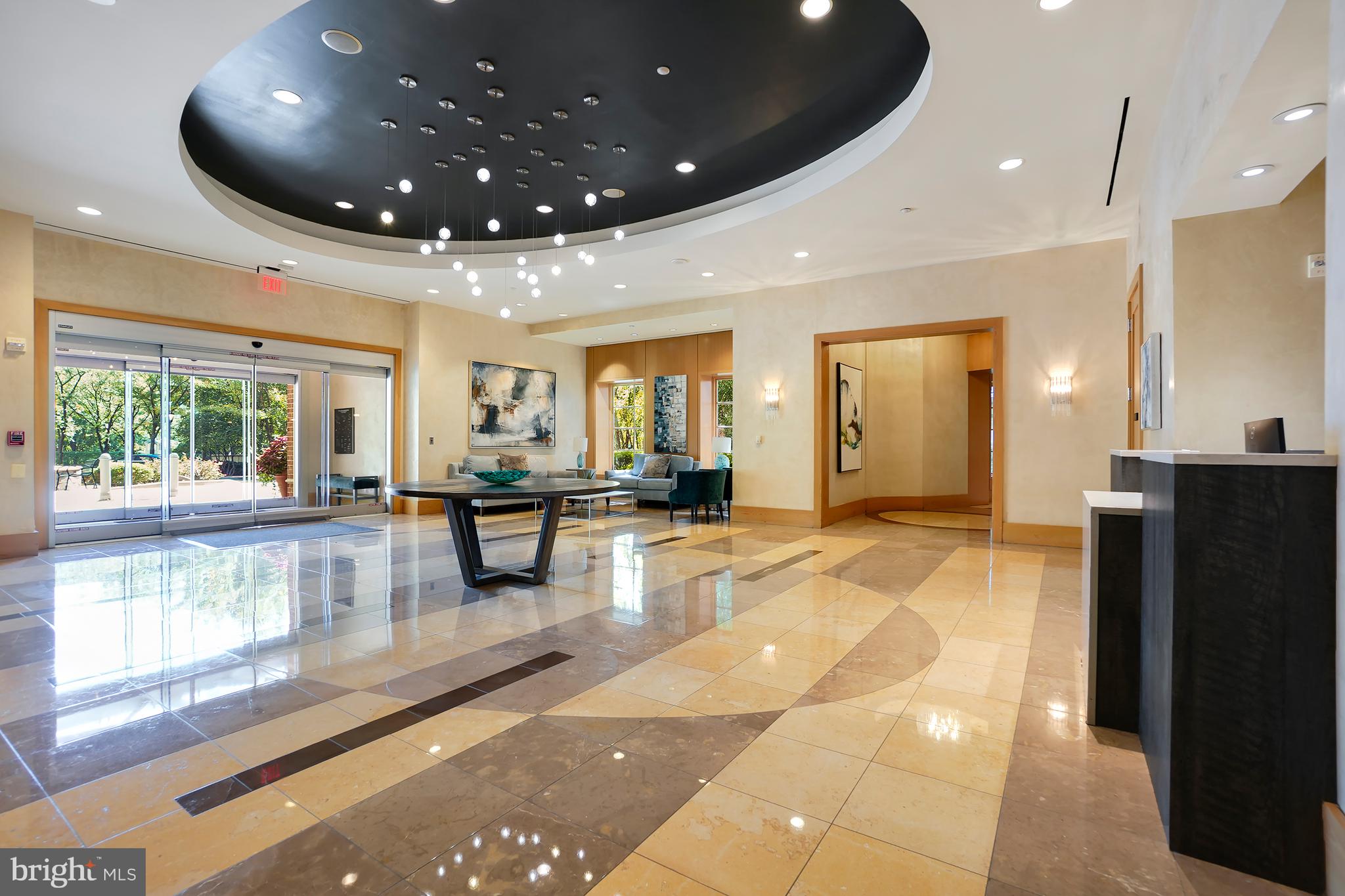 11700 Old Georgetown Road, Unit 214 Rockville, MD 20852 - Photo 4 of 44 a lobby with furniture and a large window