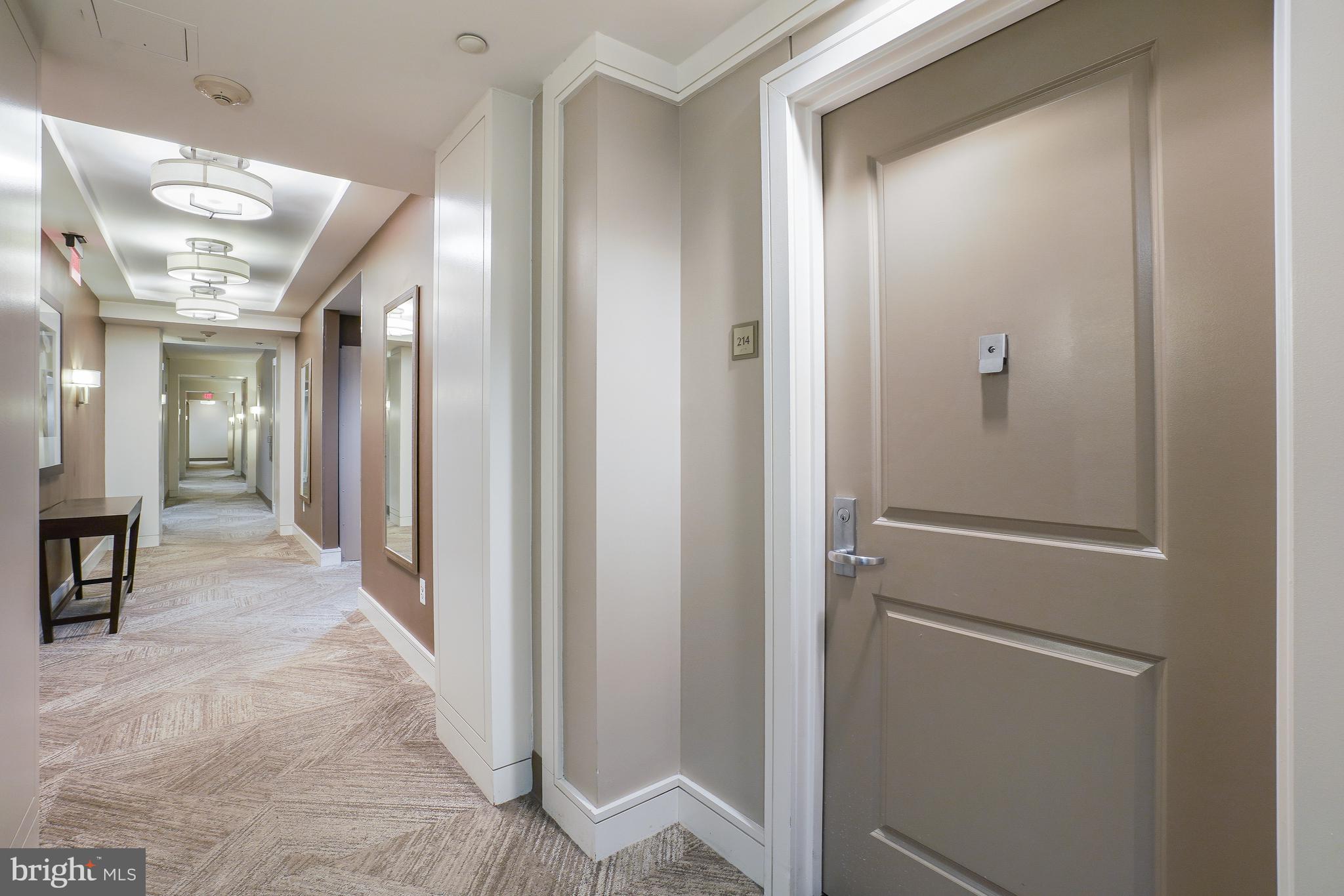 11700 Old Georgetown Road, Unit 214 Rockville, MD 20852 - Photo 5 of 44 a view of a hallway with wooden floor