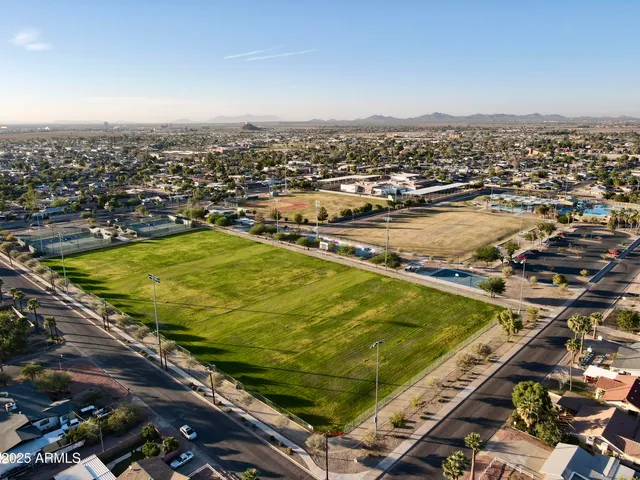 an aerial view of residential houses with outdoor space
