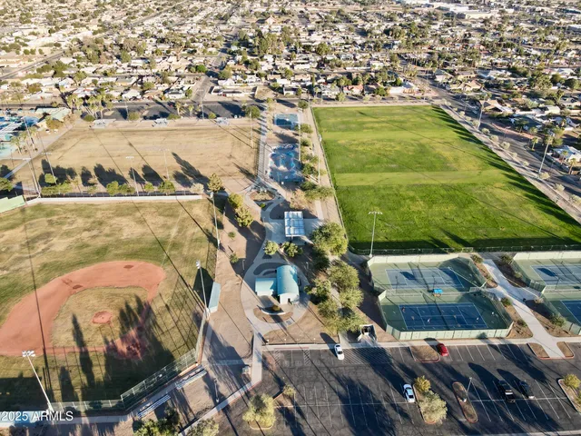an aerial view of residential houses with outdoor space