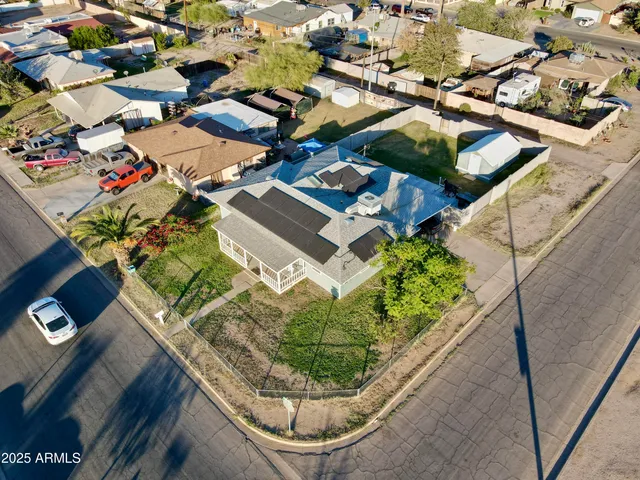 an aerial view of a houses with outdoor space