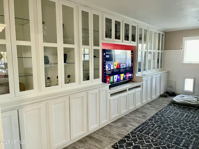 a kitchen with stainless steel appliances a cabinets and a window