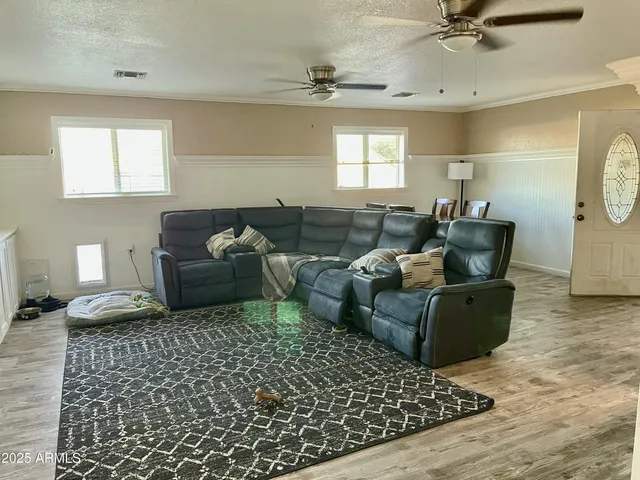 a living room with furniture and a window