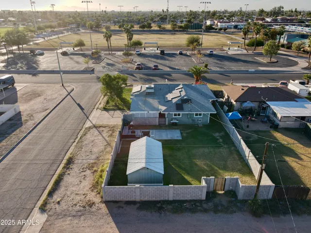 an aerial view of a house with lake view