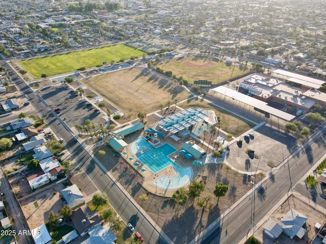 an aerial view of residential houses with outdoor space
