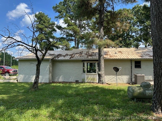 997 Balfour Road Red Springs, NC 28377 - Photo 4 of 20 a front view of a house with a garden and plants