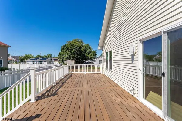 a view of a balcony with wooden floor