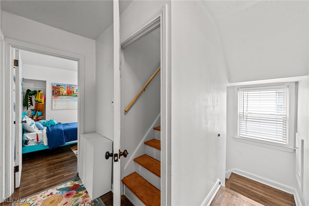 2323 Saybrook Road Cleveland, OH 44118 - Photo 23 of 42 Stairway featuring baseboards and wood finished floors