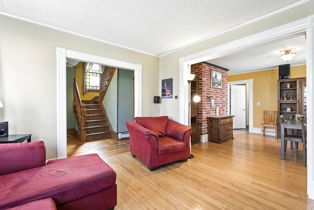 1014 Hampden Street Holyoke, MA 01040 - Photo 12 of 36 a living room with furniture and wooden floor