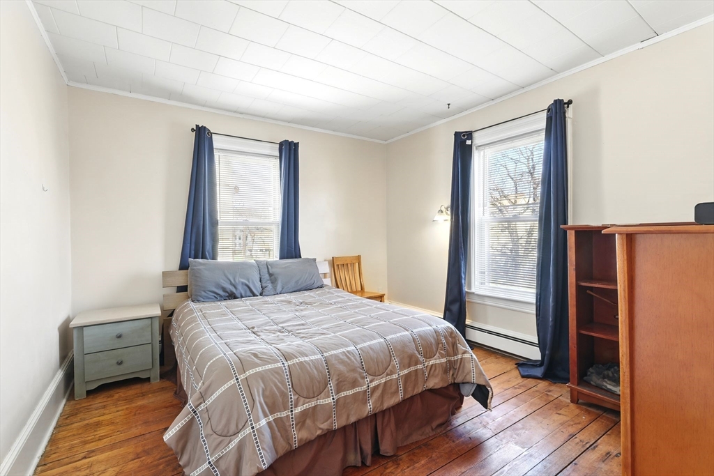 1014 Hampden Street Holyoke, MA 01040 - Photo 22 of 36 a bedroom with a bed next to a window