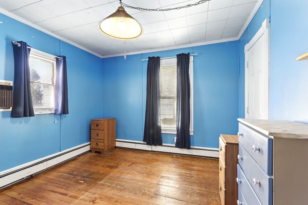 1014 Hampden Street Holyoke, MA 01040 - Photo 23 of 36 a view of a room with window and wooden floor