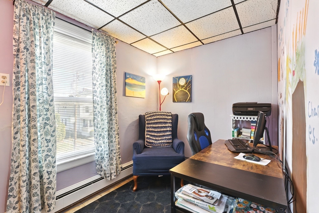 1014 Hampden Street Holyoke, MA 01040 - Photo 24 of 36 a view of a workspace with furniture and a window