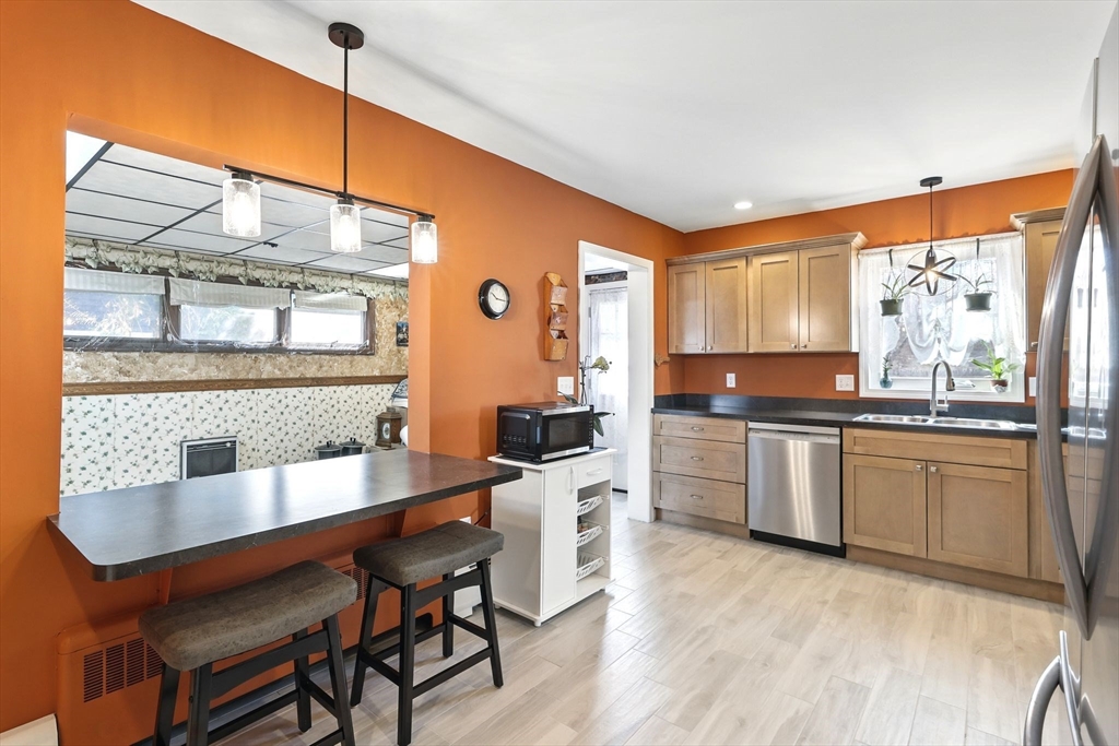 1014 Hampden Street Holyoke, MA 01040 - Photo 3 of 36 a kitchen with a sink cabinets and window