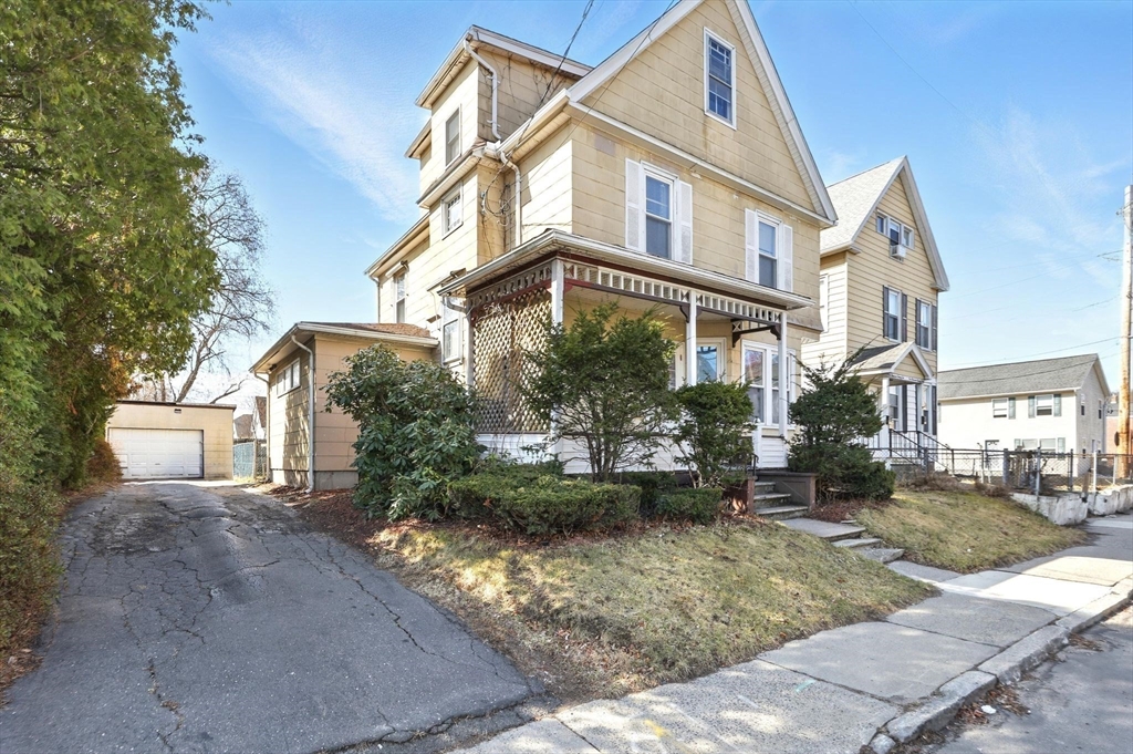 1014 Hampden Street Holyoke, MA 01040 - Photo 31 of 36 a front view of a house with garden