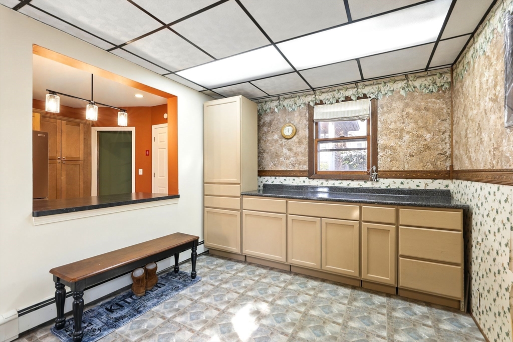 1014 Hampden Street Holyoke, MA 01040 - Photo 6 of 36 a kitchen with a sink and a window