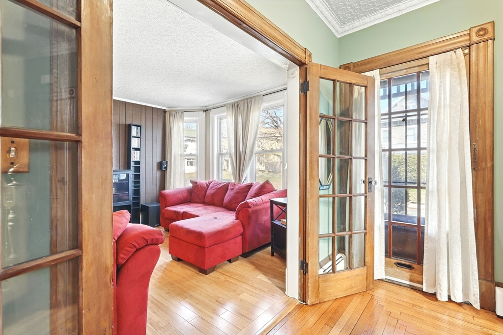 1014 Hampden Street Holyoke, MA 01040 - Photo 10 of 36 a living room with furniture and a window