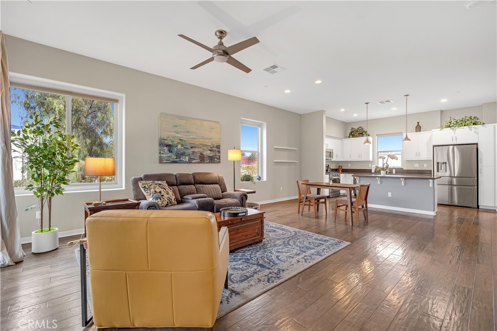 755 Sawyer Place Upland, CA 91786 - Photo 17 of 57 a living room with stainless steel appliances granite countertop furniture wooden floor and a large window