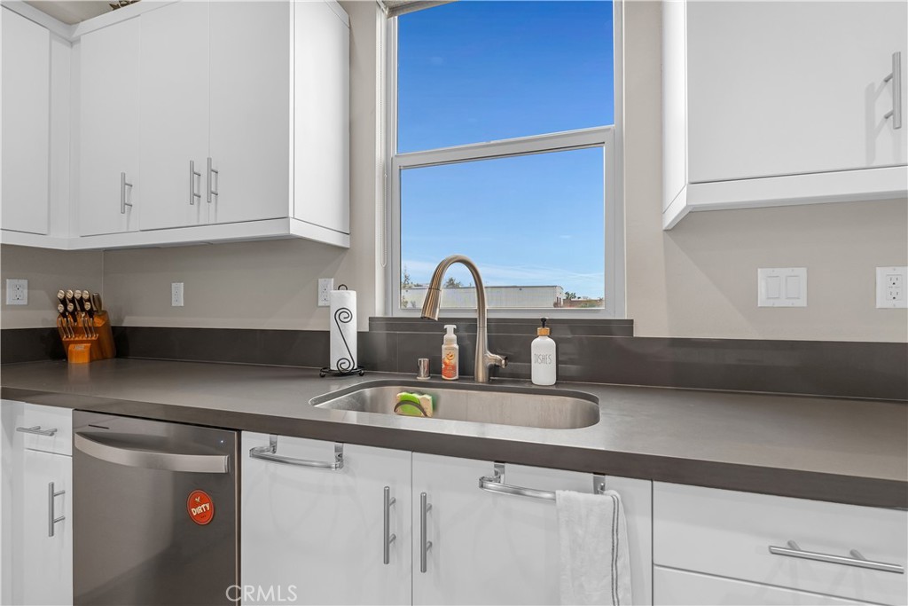 755 Sawyer Place Upland, CA 91786 - Photo 25 of 57 a kitchen with granite countertop a sink and cabinets